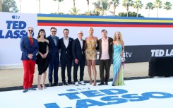 Stars of 'Ted Lasso' gather with Apple CEO Tim Cook at a Los Angeles premiere of the show's fourth season include (L-R): Brendan Hunt, Tanya Reynolds, Jason Sudeikis, John Ternus, Cook, Hannah Waddingham, Jeremy Swift and Juno Temple