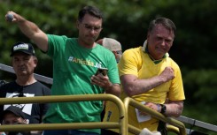 Brazil's former president Jair Bolsonaro (R) and his son Senator Flavio Bolsonaro (L) are allied with US President Donald Trump, who has backed several victorious right-wing candidates in Latin America