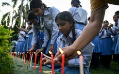 Mourners and students at Small Heaven School in Chitwan light candles after the death of mountaineer Nirmal Purja and his companions in an avalanche in Pakistan