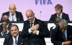 FIFA President Gianni Infantino (C) faces mounting problems after UEFA threatened legal action over his shelved plan