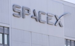 SpaceX signage is displayed outside a Space Exploration Technologies Corp. facility in Hawthorne, California in March 2026