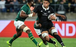 Springbok Siya Kolisi (L) prepares to tackle All Black Tupou Vaa'i during a 2025 Rugby Championship match in Wellington.