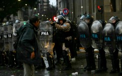Clashes broke out between police and protesters during a demonstration against private property legislation outside the National Congress in Buenos Aires