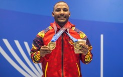 Venezuela's Julio Mayora, seen here in a handout picture from the Central American and Caribbean Games, carried cement blocks to rescue people following the twin earthquakes that struck Venezuela in June