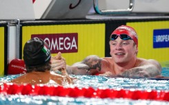 Adam Ramsay-Peaty (R) congratulates winner Nicolo Martinenghi of Italy