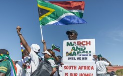 Anti-migrant protesters gathered outside the venue of a southern Africa regional summit