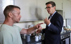 Britain's Prime Minister Andy Burnham makes a cup of tea during a visit to the homelessness charity Changing Lives in Newcastle