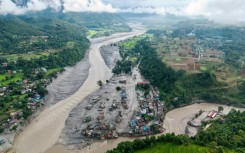 The death toll stands at 392 after a devastating tsunami-like wall of freezing water and mud wiped out towns under a torrent of sludge, engulfing homes, smashing bridges and dams and sweeping vehicles away like toys