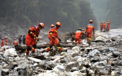 Fire and rescue personnel conduct search and rescue operations 2 kilometers from Gyirong Port days after the August 26 mudslide