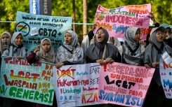 Protesters take part in an anti-LGBTQ rally organised by pro-Islamic organisations in Surabaya on August 9, 2026