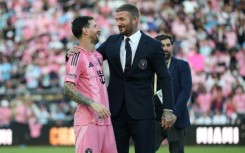 Lionel Messi (L) and David Beckham