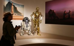A visitor views exhibits from the Star Wars gallery during the Lucas Museum of Narrative Art press preview in Los Angeles