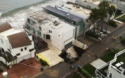 Pounding surf has created a sinkhole on one side of a multi-million dollar house in swanky Malibu that reports said belongs to Nicholas Cage