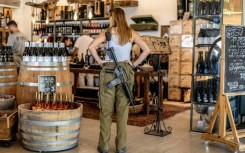 An Israeli army soldier stands at a winery in the Israeli settlement of Shaar Binyamin in the occupied West Bank