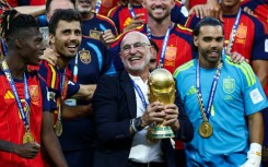 Luis de la Fuente holds the World Cup trophy after Spain beat Argentina in the final in New Jersey