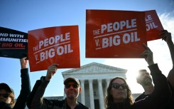 Protestors outside the US Supreme as it hears a major climate case