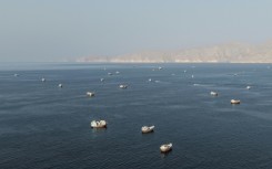 Ships anchored off the coast of Musandam governorate in Oman near the Strait of Hormuz on Friday
