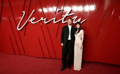US actors Josh Hartnett and Dakota Johnson pose on the red carpet upon arrival to attend the UK Gala Screening of Verity, at the Curzon Mayfair, in London in September 2025