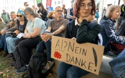 Protesters around the world -- seen here with a sign that reads 'AI? No thanks!' in Linz, Austria -- have voiced opposition to new data centers and their heavy demand on resources, as well as the use of AI in public surveillance and warfare