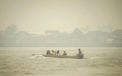 Plaintiffs point the finger at large corporations burning land to cultivate timber, rice and palm oil, or for mining