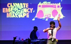 This photograph taken on October 1, 2026 shows rapper Kali, aka Akshay, performing onstage during the launch of the Indian multi-lingual rap album on climate crisis 'Climate Emergency Mixtape' at The Humming Tree in Bengaluru.