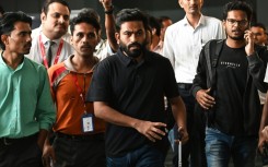 Indian activist Abhijeet Dipke (C) calls on supporters of the 'cockroach' movement to protest across the country