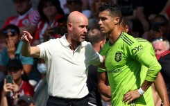 Former Manchester United manager Erik ten Hag speaking to Cristiano Ronaldo