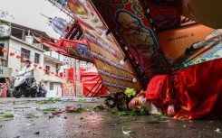 Typhoon Champi dumped heavy rain, toppled trees and knocked out power to thousands of homes